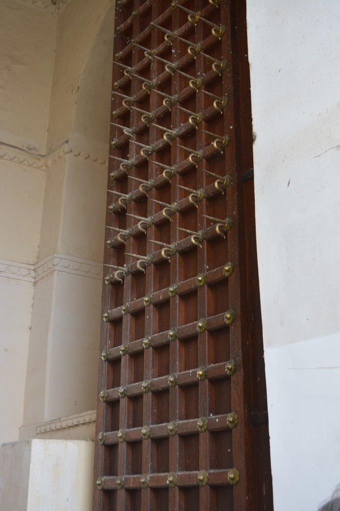 Spikes on the upper portion to stop attackers using elephants to push them in.